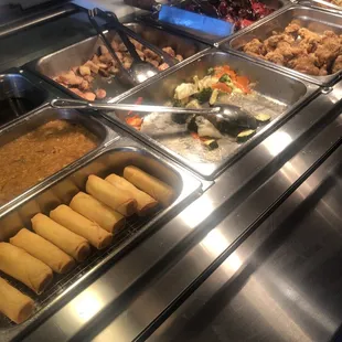 a variety of food items in a buffet