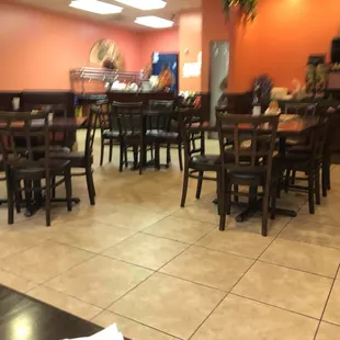 a restaurant with tables and chairs