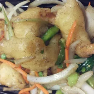 salt pepper shrimp it has onions peppers and peas carrots stir fried with crispy breaded shrimps in salt and pepper seasoning.