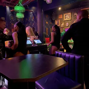  a group of people at a bar