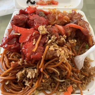 plate with chow mein, rice, orange chicken, and sweet and sour chicken