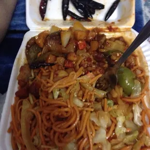 a plate of noodles and vegetables