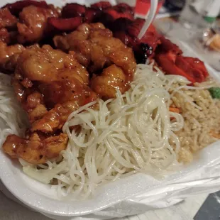orange chicken, sweet n sour chicken on top of rice noodles and rice