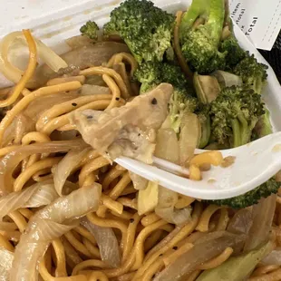 a plate of noodles and broccoli