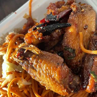 a plate of food in a styrofoam container