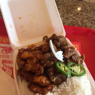 White rice spicy orange chicken and spicy pulled pork very tasty and I dislike Chinese food lol