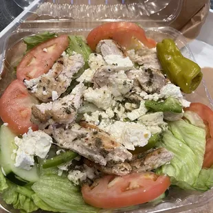 a salad in a plastic container