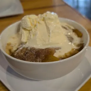 Homade peach cobbler with vanilla ice cream