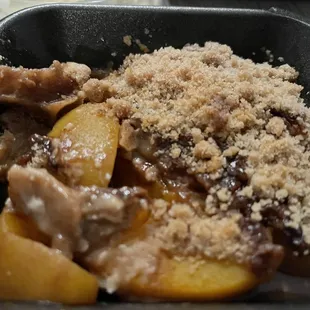 Peach cobbler was delicious with ice cream on top