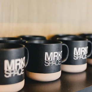 a row of coffee mugs