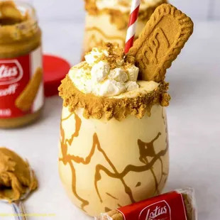 a milkshake with whipped cream and cookies