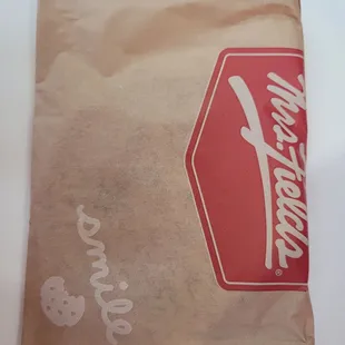 a paper bag with a logo on it
