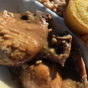 My goodness!  Fried Pork Chops with Gravy... Cornbread and beans are on point!!  Love