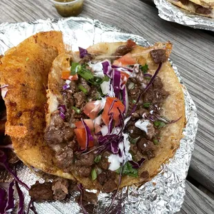 a taco with meat and vegetables