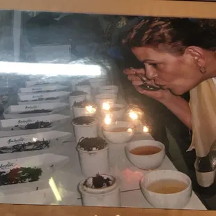 a woman blowing out candles