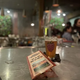 a pint of beer and a menu