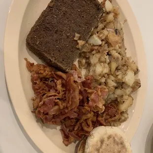 Scrapple, bacon, breakfast potatoes, English muffin