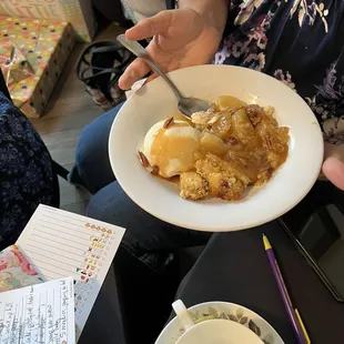 a woman holding a plate of food