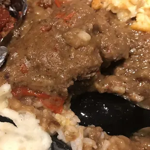 Salisbury steak, perfection, served over rice