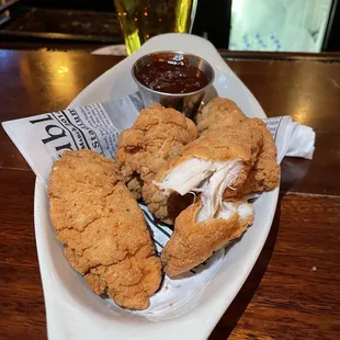 Another view of chicken tenders with barbecue sauce