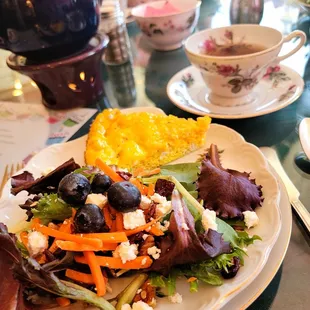 a plate of salad and a cup of tea
