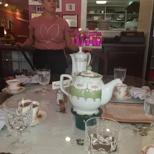 a woman standing at a table