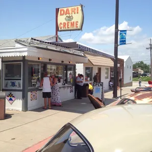 a woman standing in front of a store
