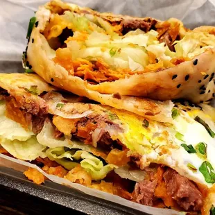 two burritos in a basket