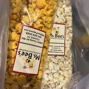 A medium bag of Cheddar and a medium bag of Dill pickle.