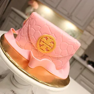 a pink and gold cake