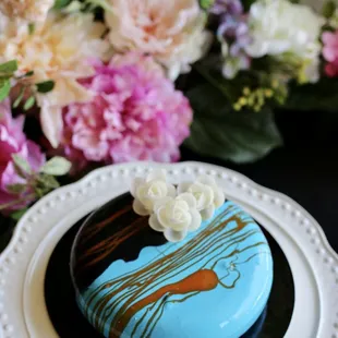 a blue cake on a white plate