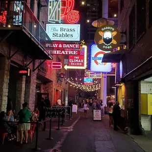 neon signs along a city street