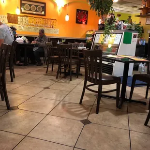 a man sitting at a table in a restaurant