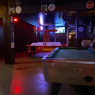 a pool table in a bar
