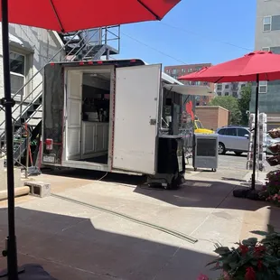 The coffee truck in the back of the patio