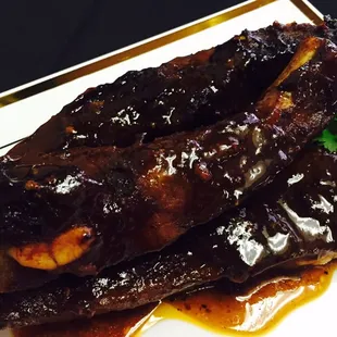 BarBQ ribs no charbroiling here slow cooked on a pit grill homemade sauce or dry they are tender n juicy