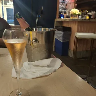 a glass of wine on a table