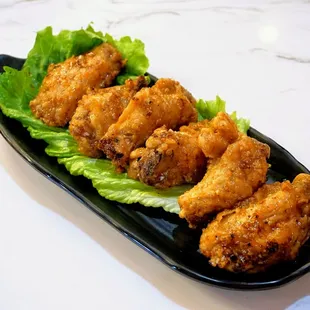 A8. Saigon Chicken Wings in Sweet Fish Sauce: famous Phu Quoc fish sauce marinated chicken wings deep fried ($13).