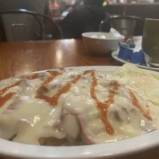 Cream chipped beef on white toast with 2 eggs over easy.