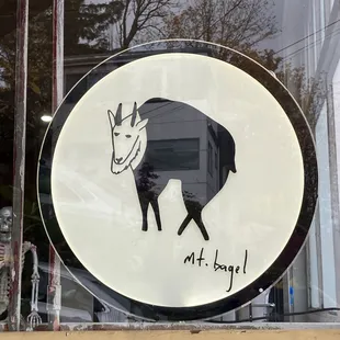 a picture of a goat in a window