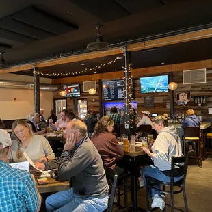 a large group of people sitting at tables