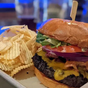 a cheeseburger and potato chips