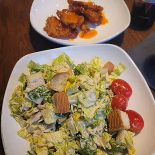 Caesar salad and coconut shrimp