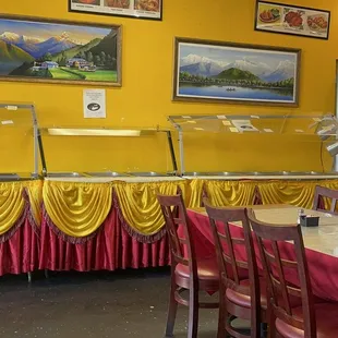 a dining area with tables and chairs