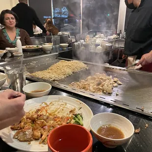 a group of people preparing food