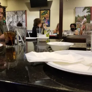 a woman sitting at the bar