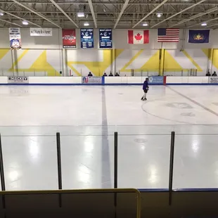 Looking at middle area of ice rink from seats