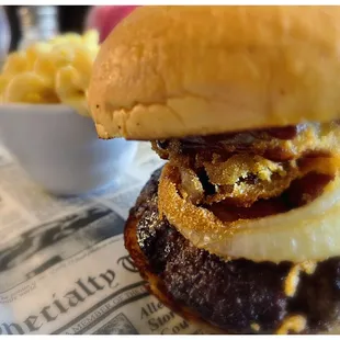 a burger with onion rings