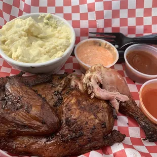 Half of a chicken hot of the smoker with delicious potato salad. Yum!