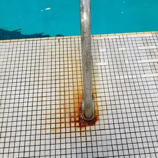 Rust on the railings leading into the pool